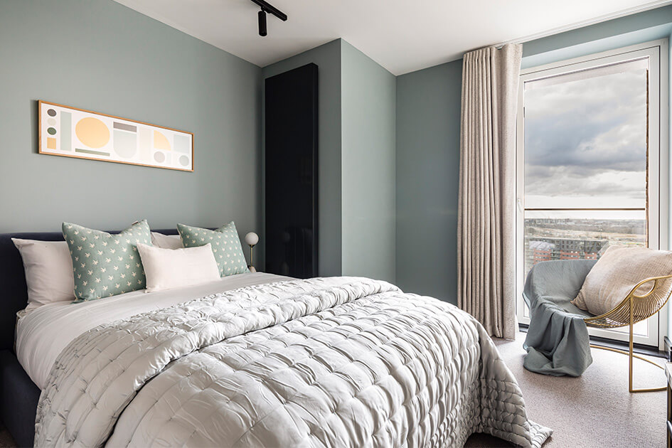A pastel coloured bedroom with a view at Citypark Gardens by Galliard Homes