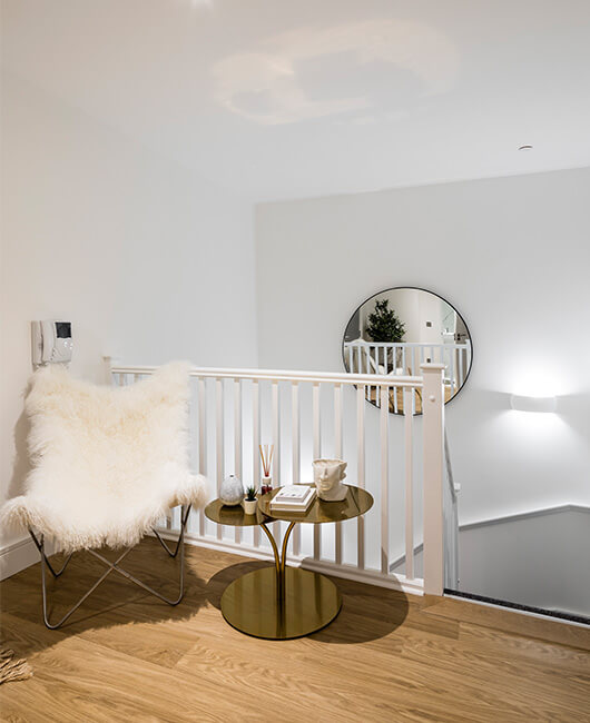 A staircase and landing area at a Timber Yard duplex apartment in Birmingham.