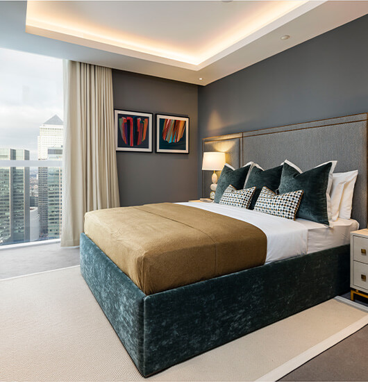 A bespoke designed penthouse bedroom at Harbour Central by Galliard Homes