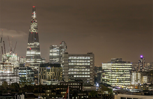 A nighttime view of London including The Shard