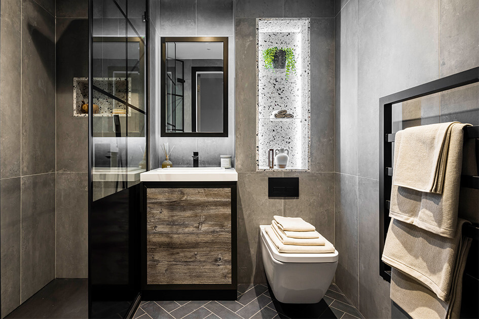 A stylish bathroom with a crittal shower door and terrazzo tiling