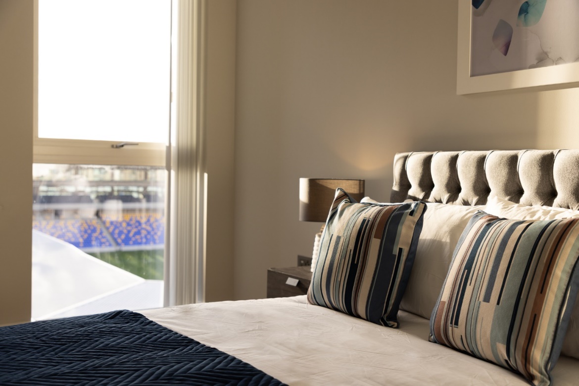 A picture containing wall, indoor, bed, room
Description automatically generated
