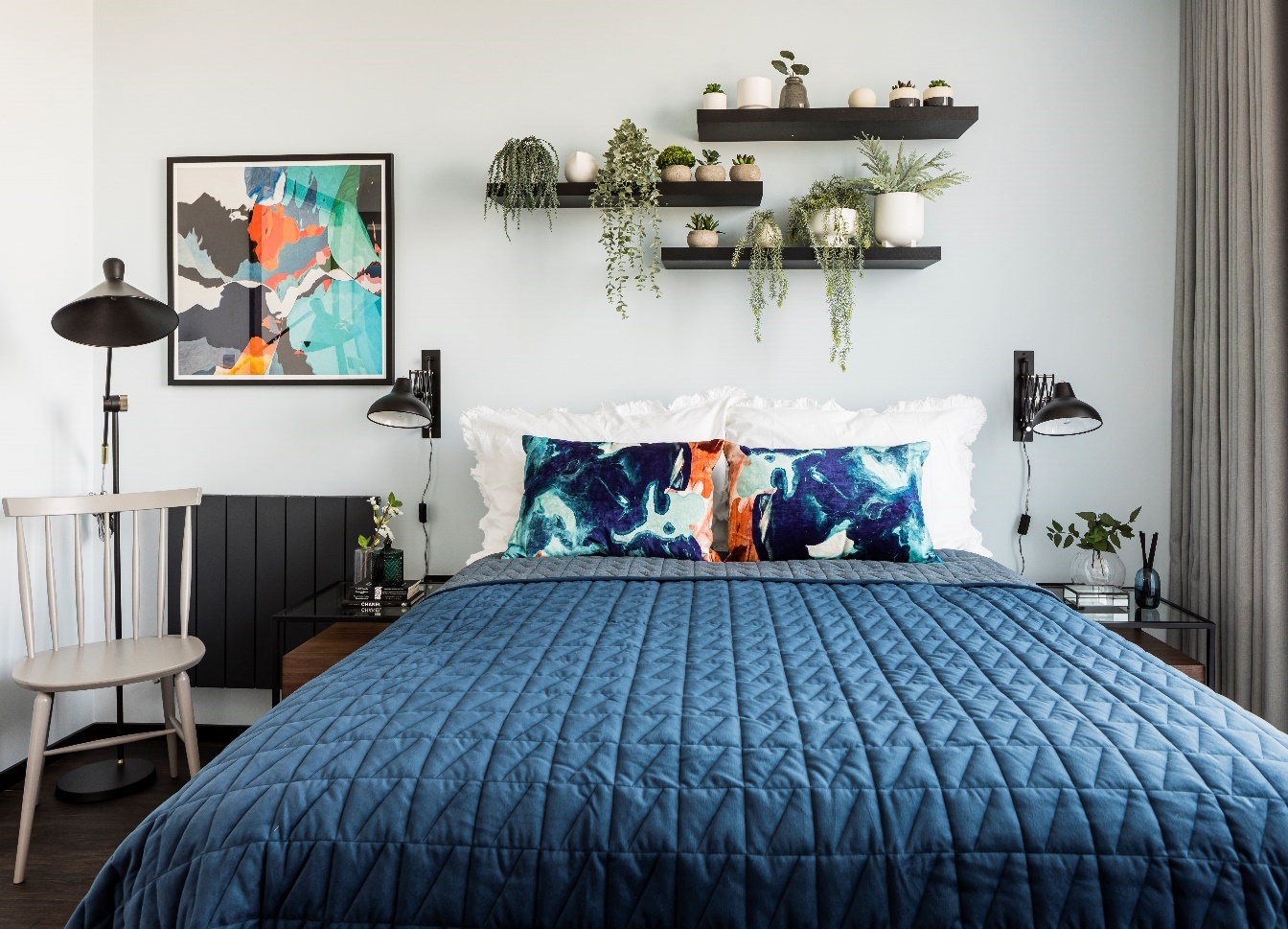 A bed with blue sheets
Description automatically generated with low confidence