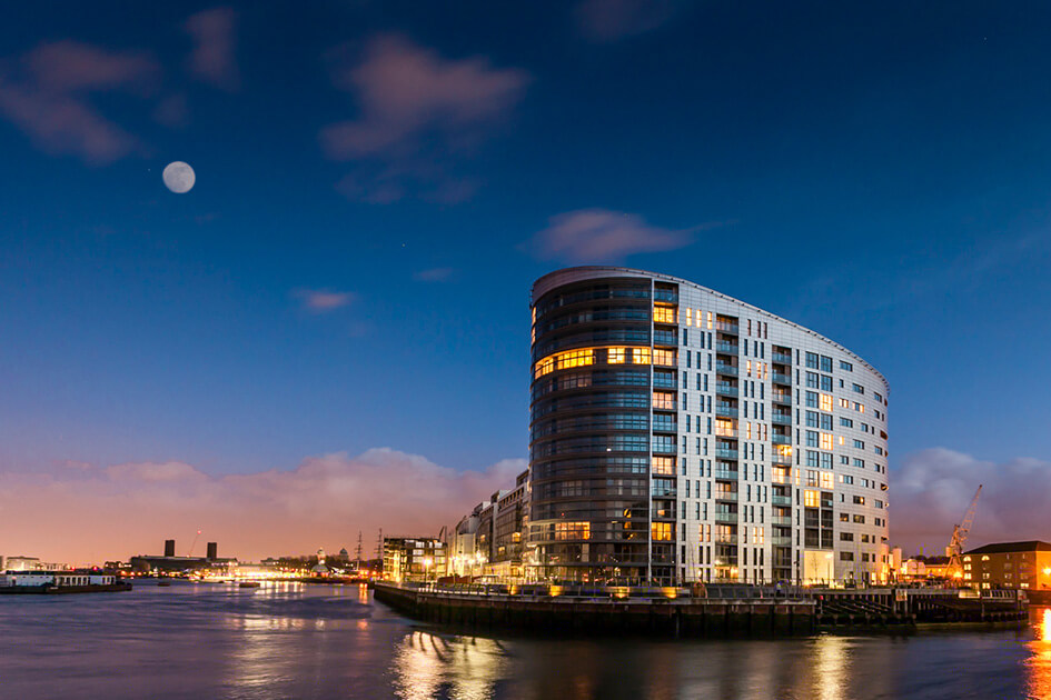 New Capital Quay by Galliard Homes at night.