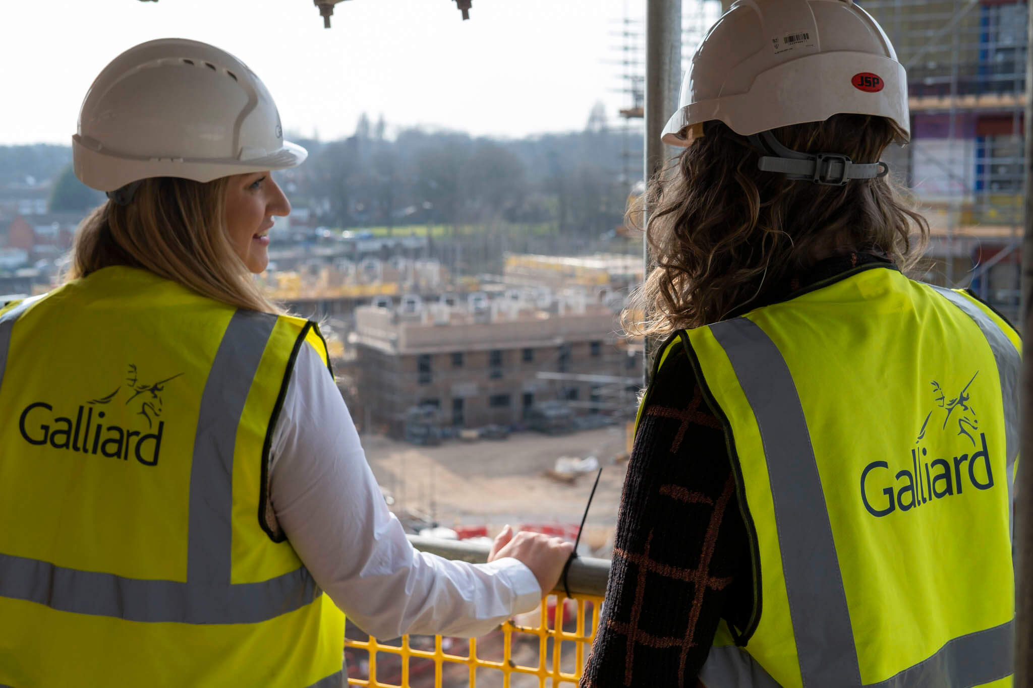 Two female construction workers on a building site
