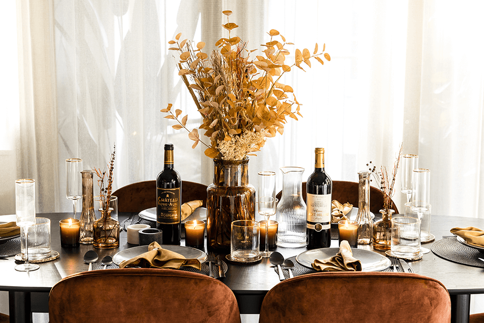 An autumnal floral centrepiece on an autumn themed dining table 