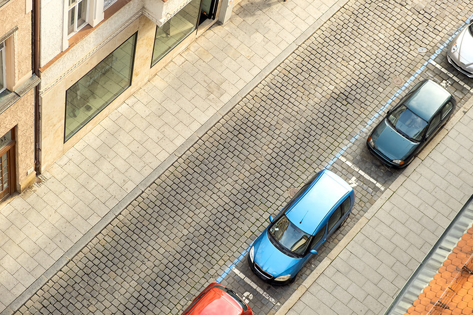 A road with parked cars.