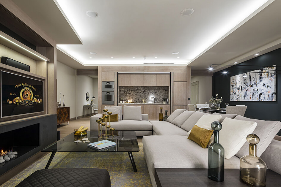 A large L-shape sofa and TV area at a show apartment at the Galliard's prestigious development, The Chilterns.