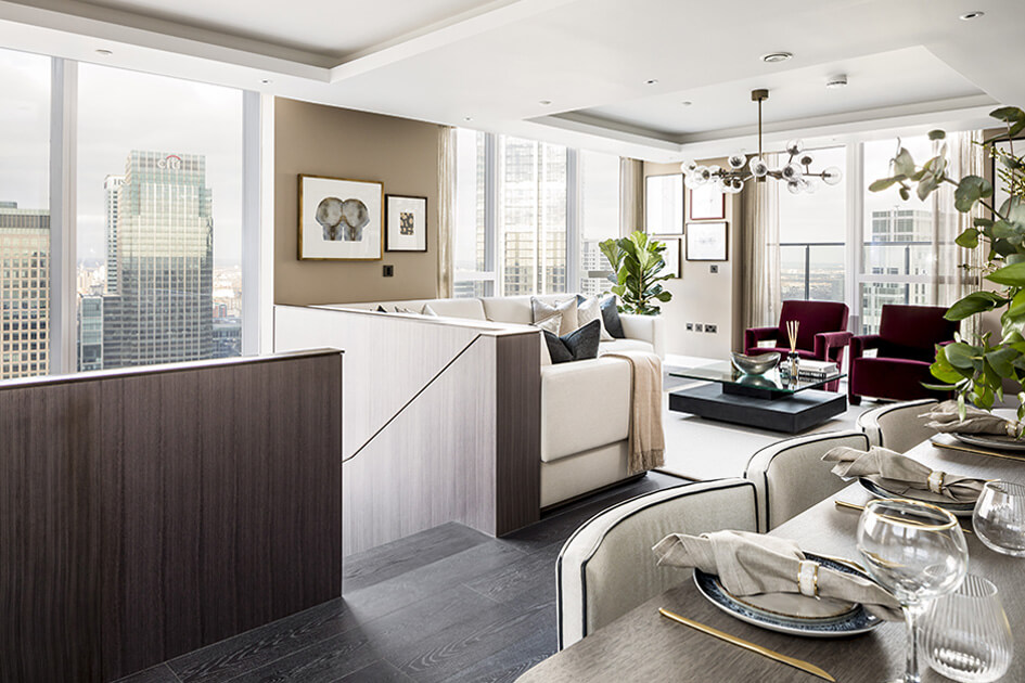A luxurious living and dining area at the Harbour Central penthouse in London Docklands with views of Canary Wharf.