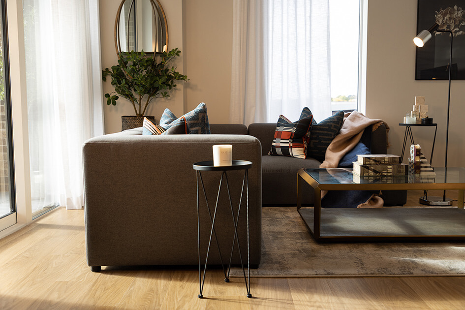 A sofa and coffee table at a show apartment at Wimbledon Grounds.