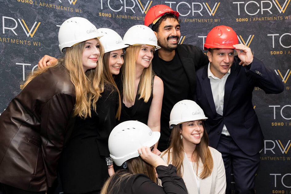Guests having their photo taken with hard hats on