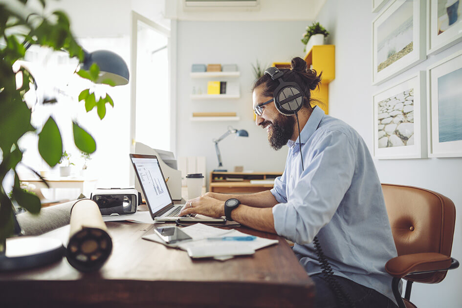 Man on laptop working from home