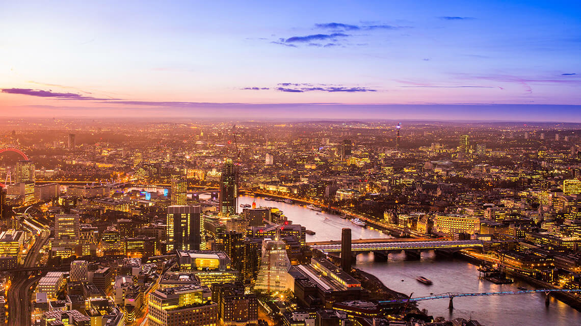 London skyline including the River Thames at dusk.