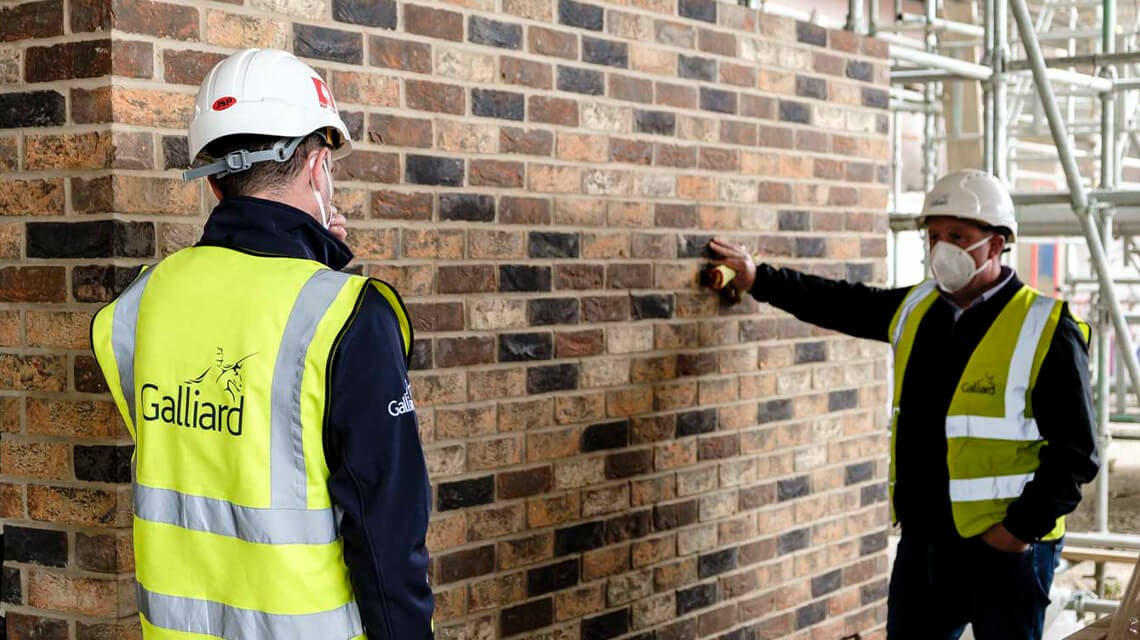 Two Galliard construction workers on-site.