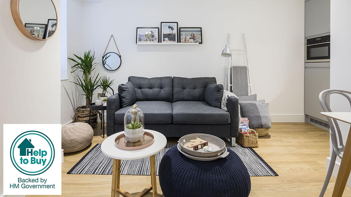 A living area at a Galliard Homes apartment with the Help to Buy logo.