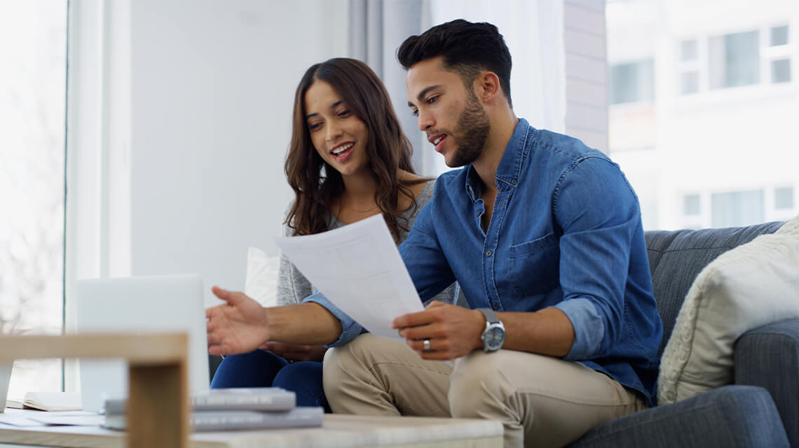 First-time buyers looking at a laptop.