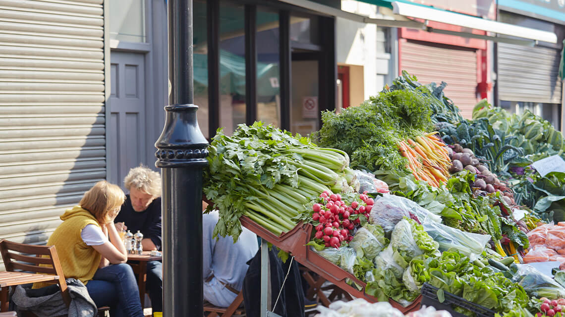 A market stall selling fruit and veg in Islington