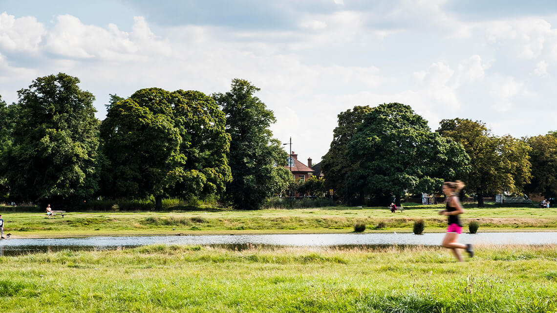 A person running through Wimbledon Common.