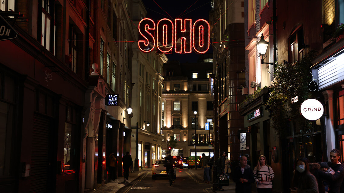 A street in Soho, London at night.