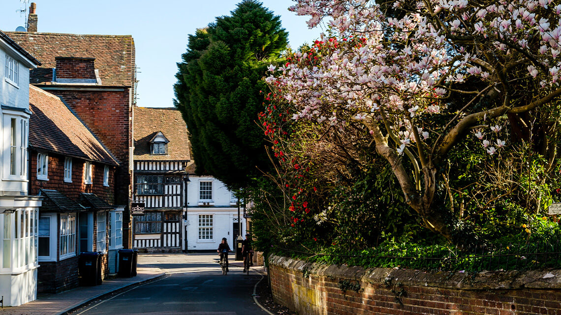 Location of East Grinstead, cyclists riding down a street