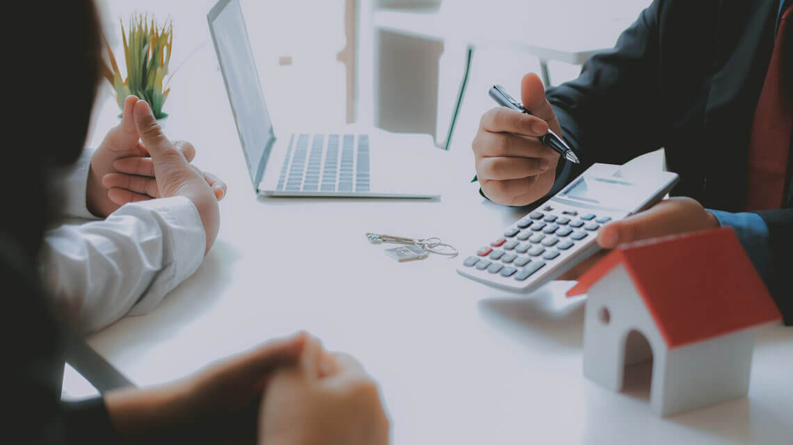 Landlord speaking to a mortgage advisor regarding a Buy-to-Let mortgage.