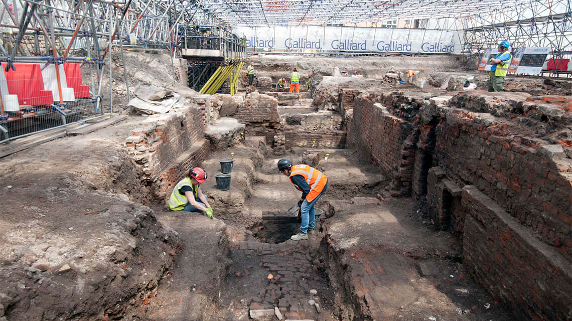 MOLA archaeologists at the site of the former Curtain Theatre.