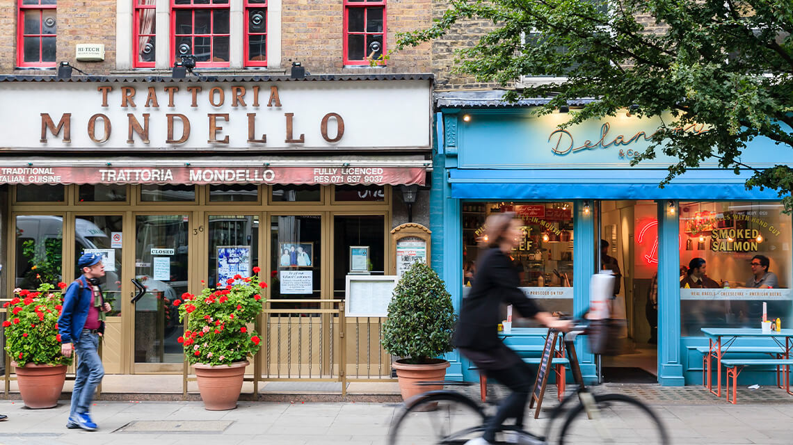 A person on a bike riding through Fitzrovia