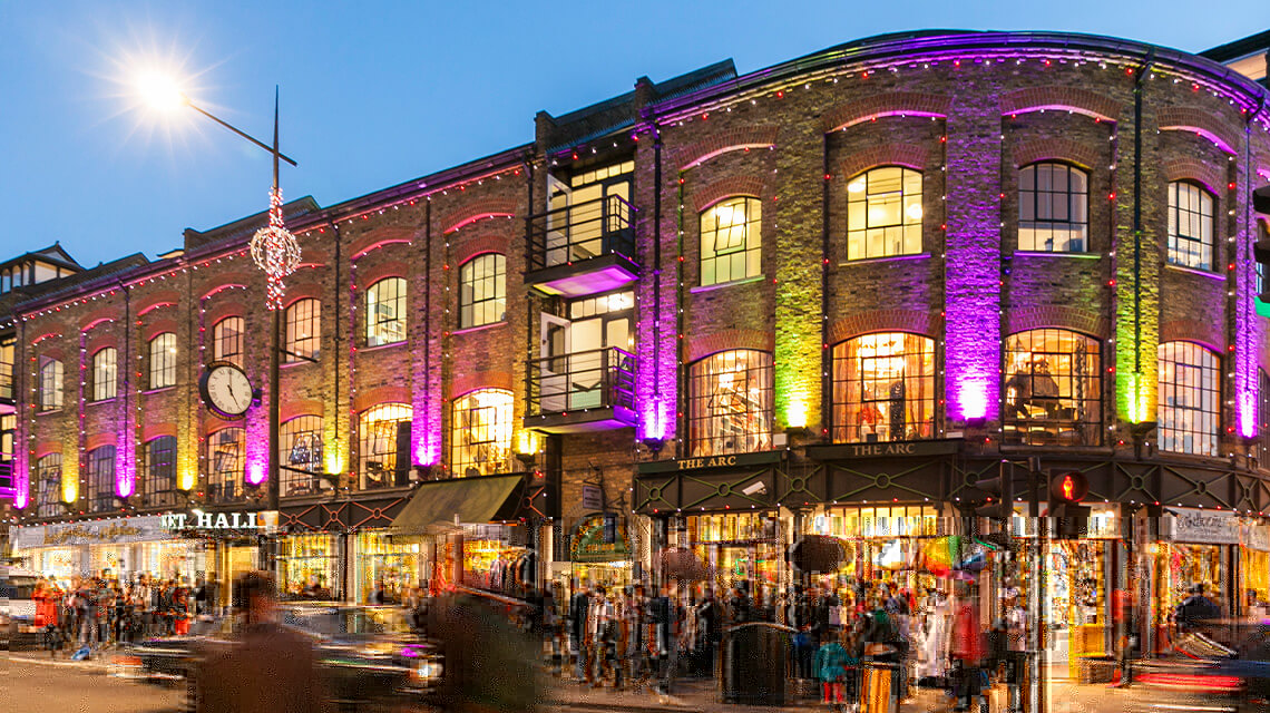 A busy high street in Camden in the evening.