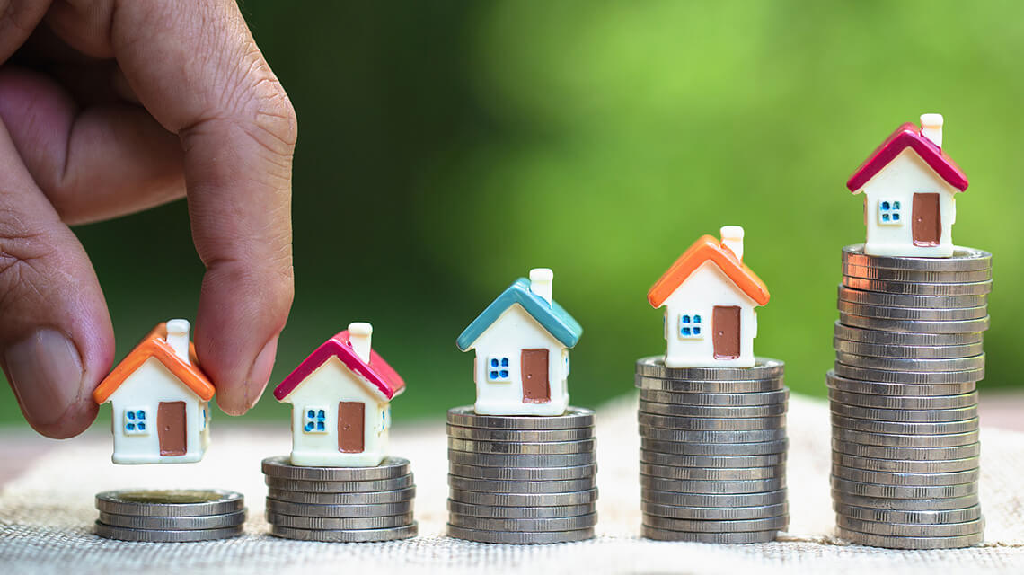 Houses arranged on top of money, Galliard Homes article title reads "Getting a mortgage on a second home"