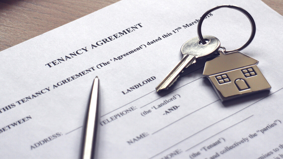 A tenancy agreement and a key.