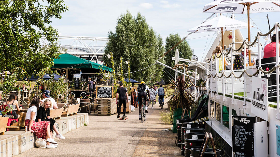 Hackney Wick Canal Café with cyclists, Galliard Homes image