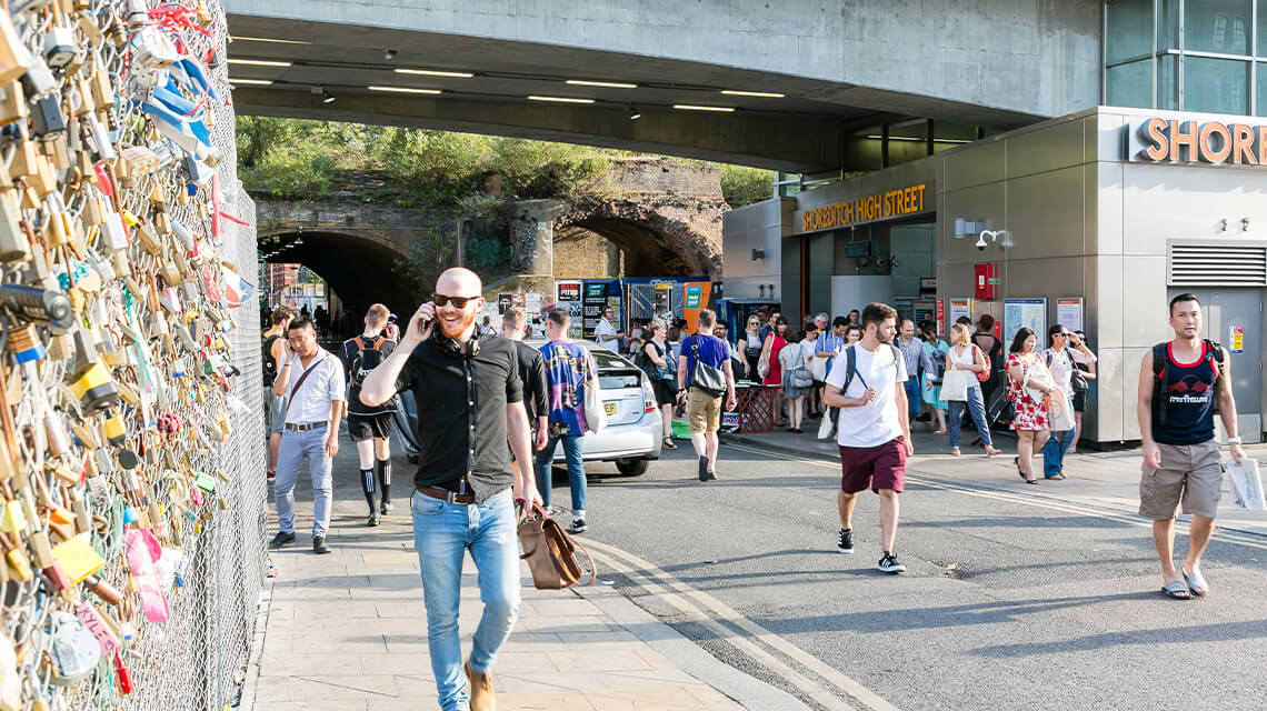 A crowd outside Shoreditch High Street station.