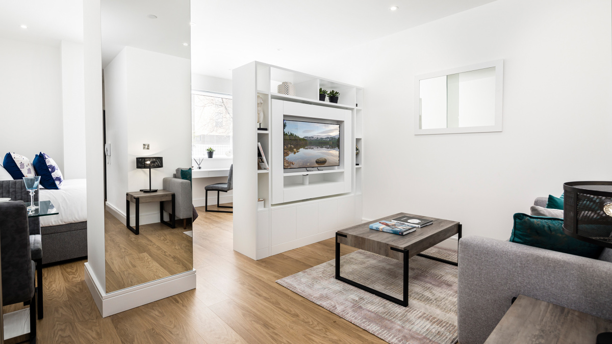 Open-plan kitchen and living area at a Papermill House studio apartment, ©Galliard Homes.