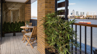 Balcony with views of the River Thames and Canary Wharf at the Wapping Riverside show apartment, ©Galliard Homes.