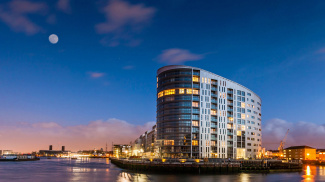 New Capital Quay exterior at night, ©Galliard Homes.