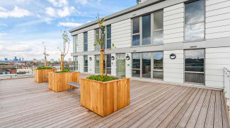 Communal roof terrace decking section at Distillery Crescent, ©Galliard Homes.