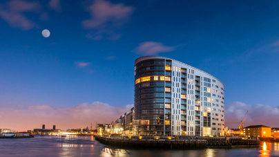 New Capital Quay exterior at night, ©Galliard Homes.
