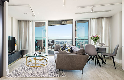 A living and balcony area in a 44th floor apartment at Baltimore Tower.