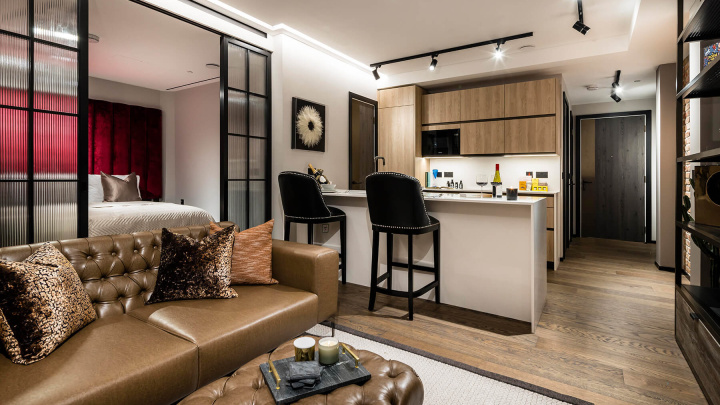 Open-plan living room and kitchen of a one-bedroom apartment at The Stage, ©Galliard Homes.
