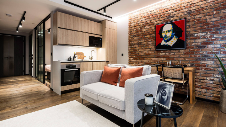 Open-plan living area in a studio suite at The Stage, ©Galliard Homes.