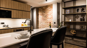 Open-plan kitchen area of a one-bedroom apartment at The Stage, ©Galliard Homes.