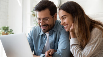 Couple calculating their Stamp Duty with the Galliard calculator