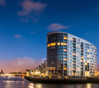 New Capital Quay exterior at night, ©Galliard Homes.