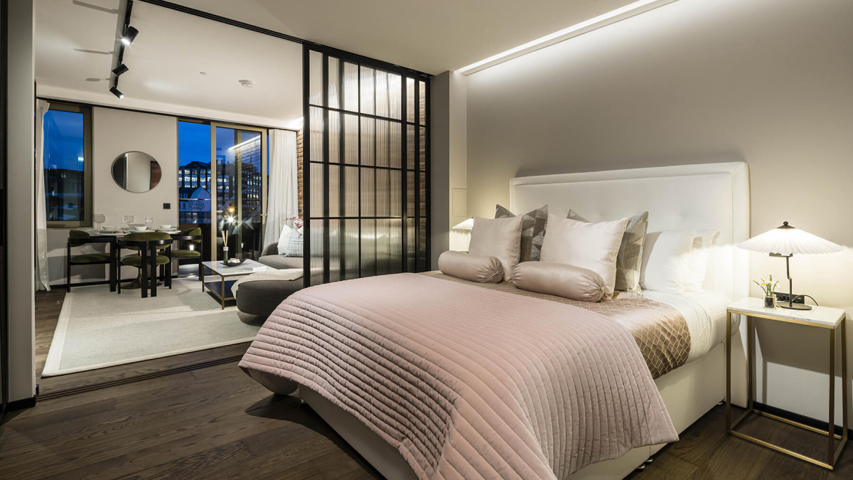 Open-plan living and bedroom area in a studio suite at The Stage, ©Galliard Homes.