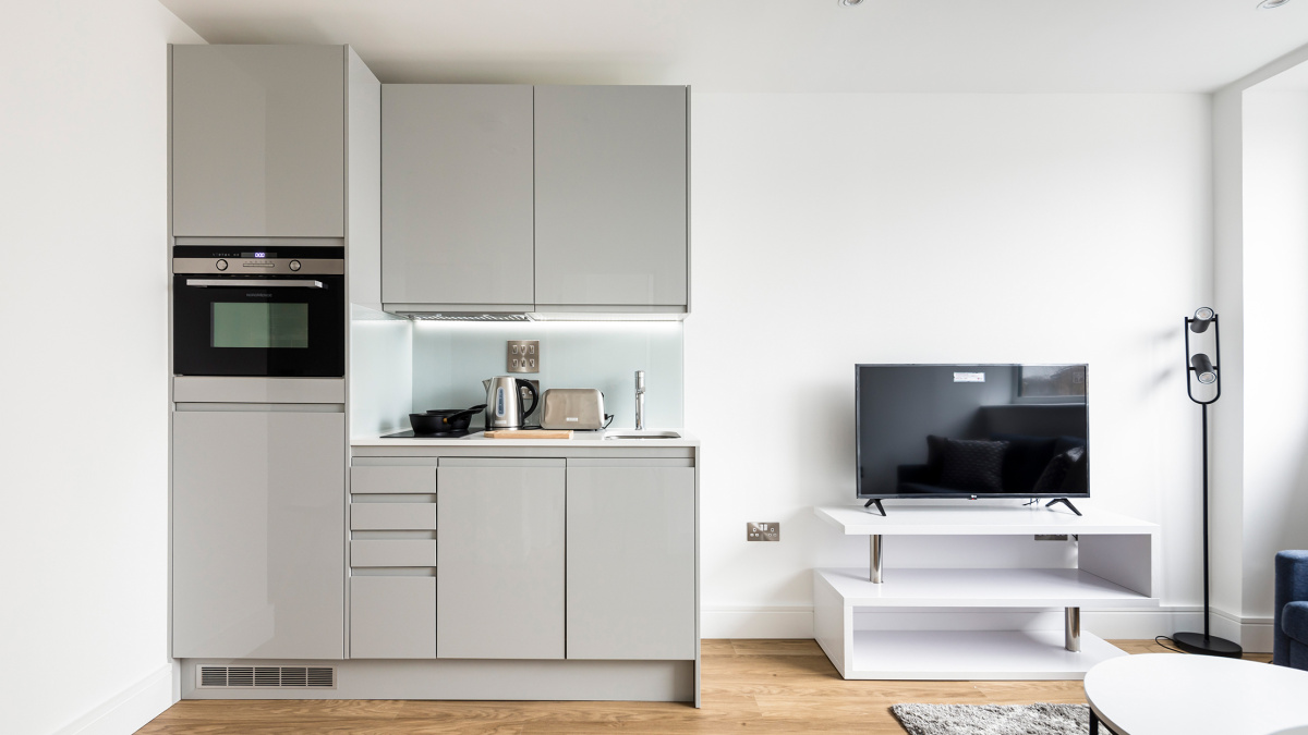 Open-plan kitchen and living area at a Galliard Homes apartment, ©Galliard Homes.