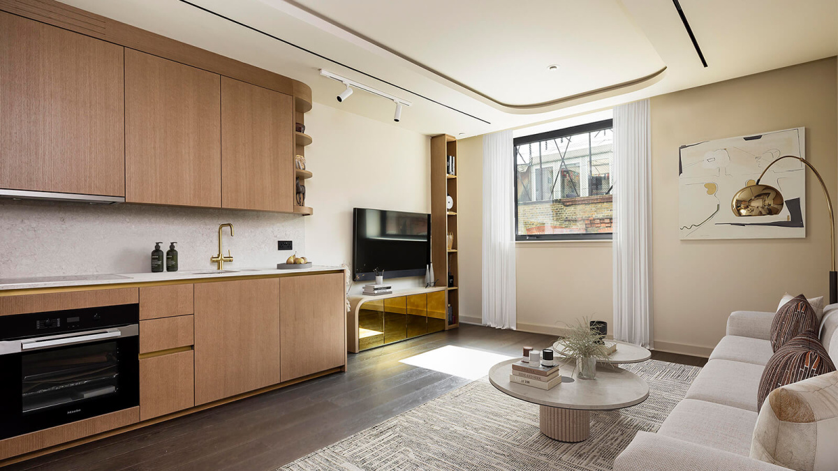 Open-plan kitchen and living area at a TCRW SOHO studio apartment, computer generated image intended for illustrative use only, ©Galliard Homes.