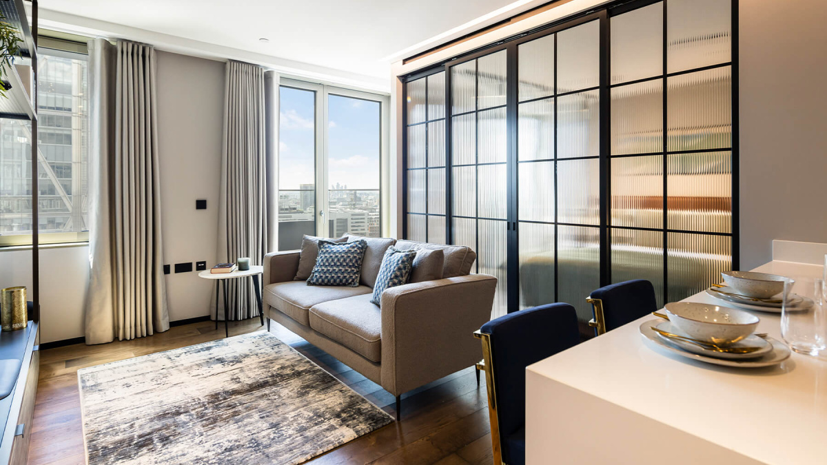 Open-plan living room of a one-bedroom apartment at The Stage, ©Galliard Homes.