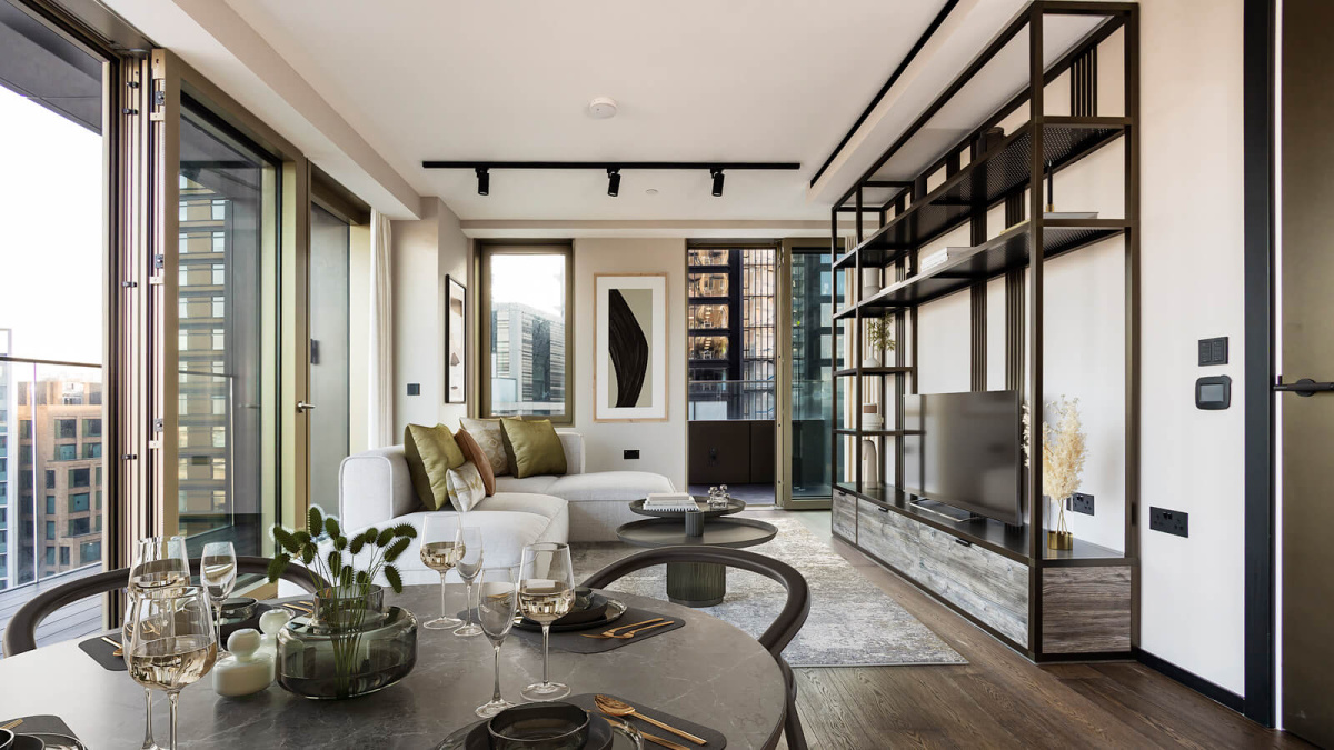 Living and dining room at a two-bedroom apartment at The Stage, furniture superimposed for illustrative purposes only, ©Galliard Homes.