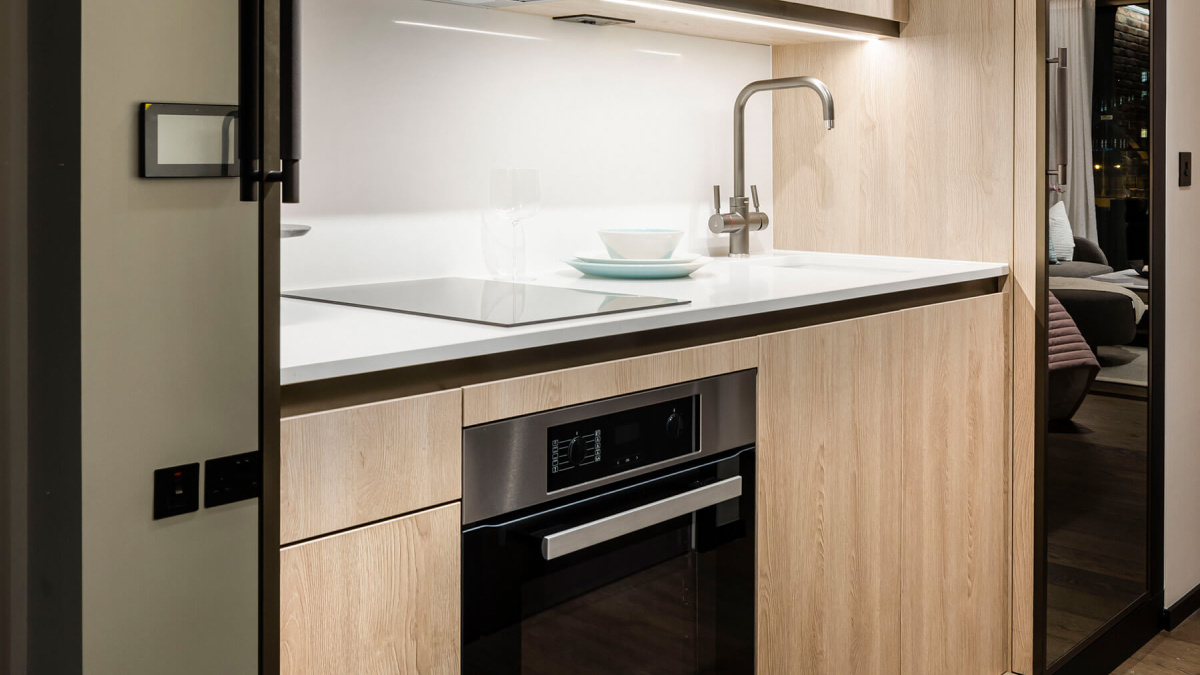 Fully-fitted kitchen in a studio suite at The Stage, ©Galliard Homes.