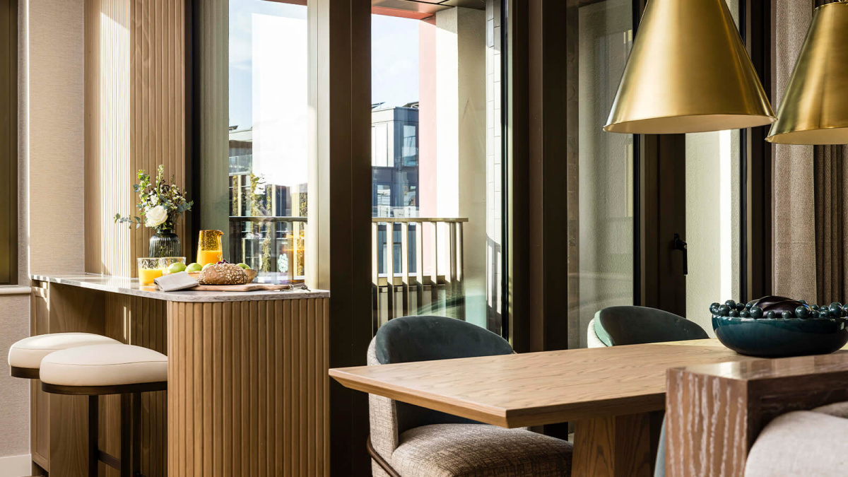 Dining area and adjoining balcony at this TCRW SOHO penthouse ©Galliard Homes.